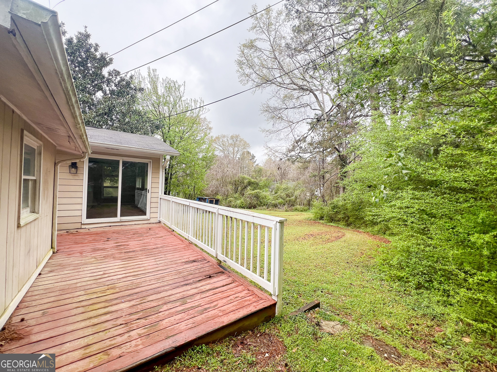 2250 Green Street Concord, GA 30206 - Photo 52 of 77 a view of a wooden deck and a yard