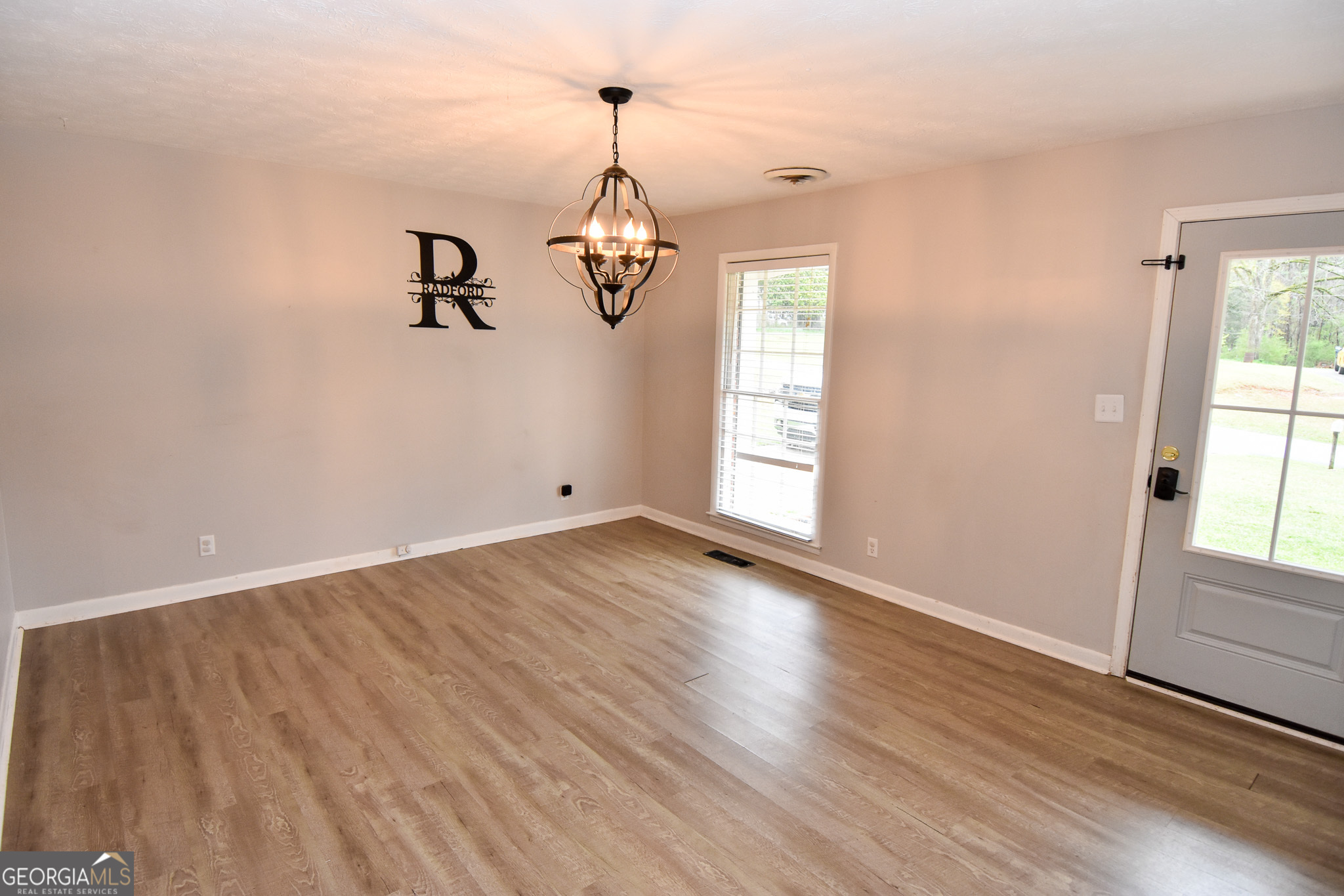 2250 Green Street Concord, GA 30206 - Photo 9 of 77 wooden floor in an empty room with a window