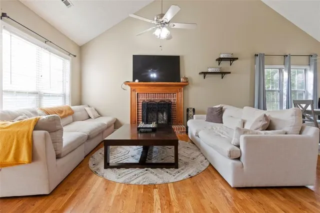 a living room with furniture and a fireplace