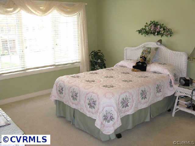 906 Rise Shaft Road Midlothian, VA 23114 - Photo 8 of 10 a bedroom with a bed and window