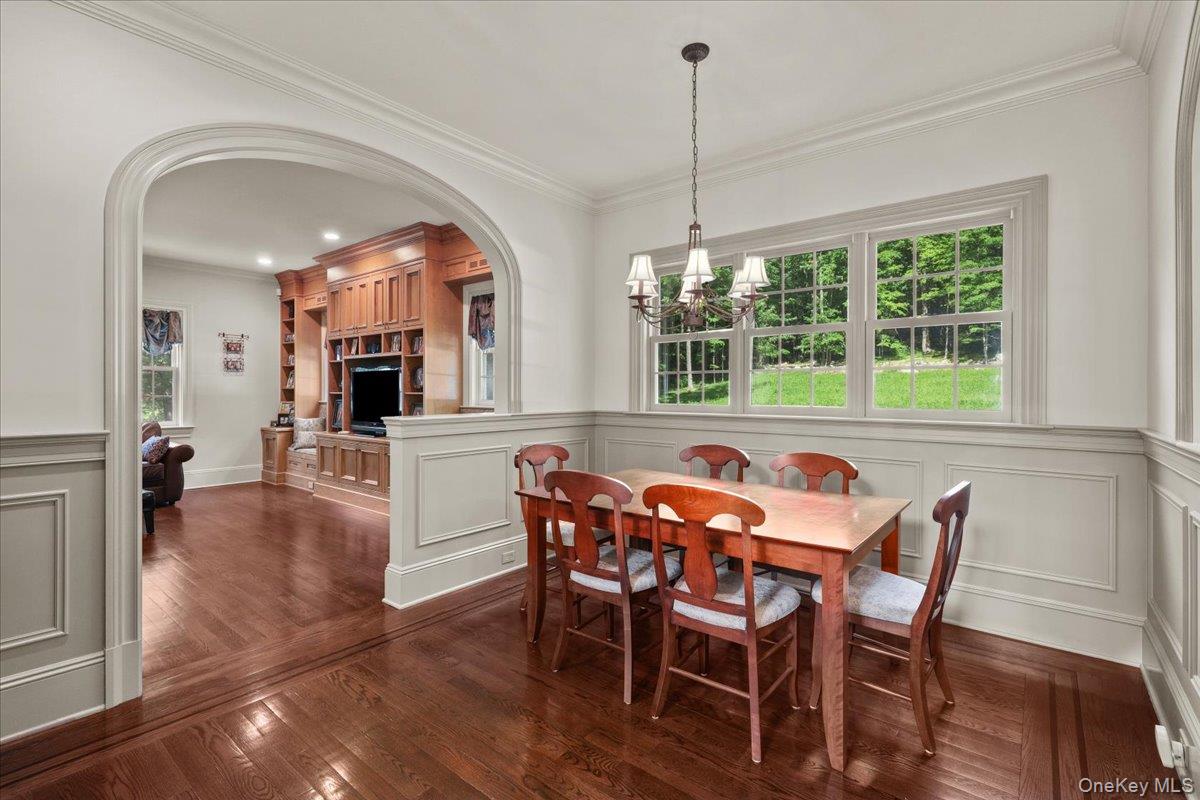 135 Pines Bridge Road Katonah, NY 10536 - Photo 12 of 40 a view of a dining room with furniture window and wooden floor