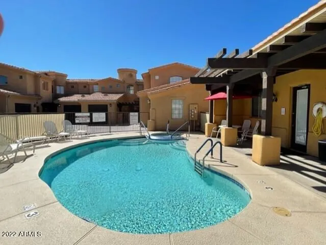 a view of a swimming pool with a patio
