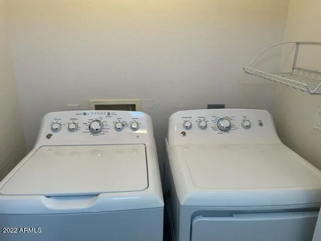 a view of a balcony with furniture