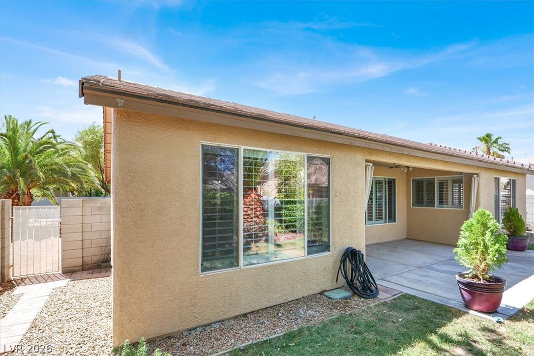 7308 Rustic Meadow Street Las Vegas, NV 89131 - Photo 26 of 27 A private backyard oasis with ample patio space and verdant landscaping.