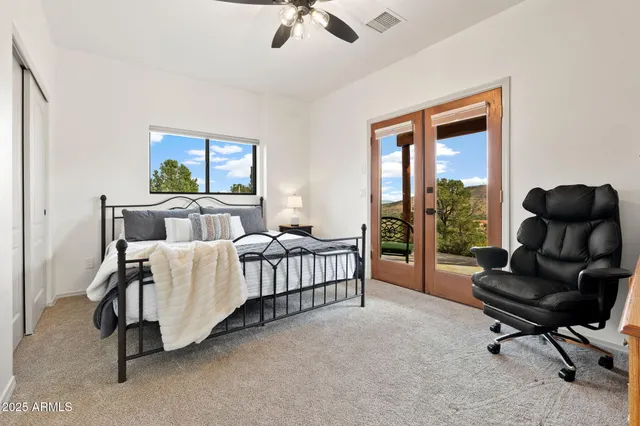 a bed room with furniture and a window