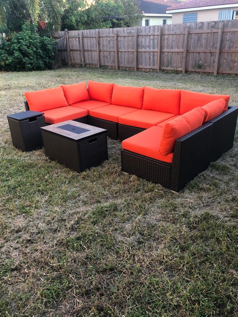 10836 Southwest 245th Street Homestead, FL 33032 - Photo 17 of 18 a view of a backyard with furniture