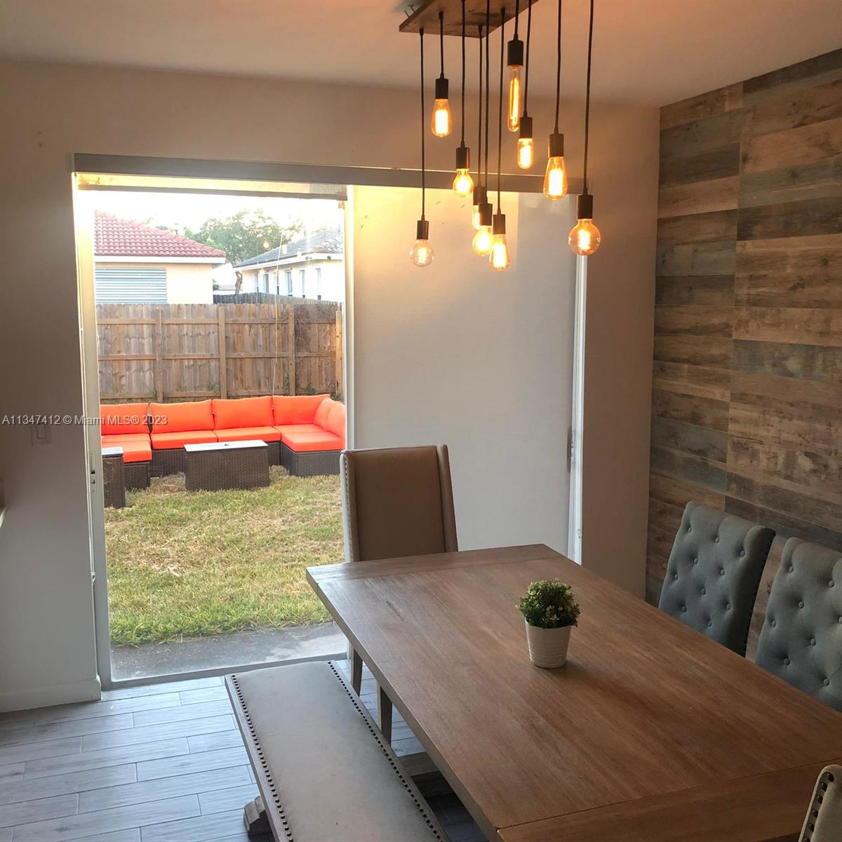 10836 Southwest 245th Street Homestead, FL 33032 - Photo 7 of 18 a bed room with a bed and glass door