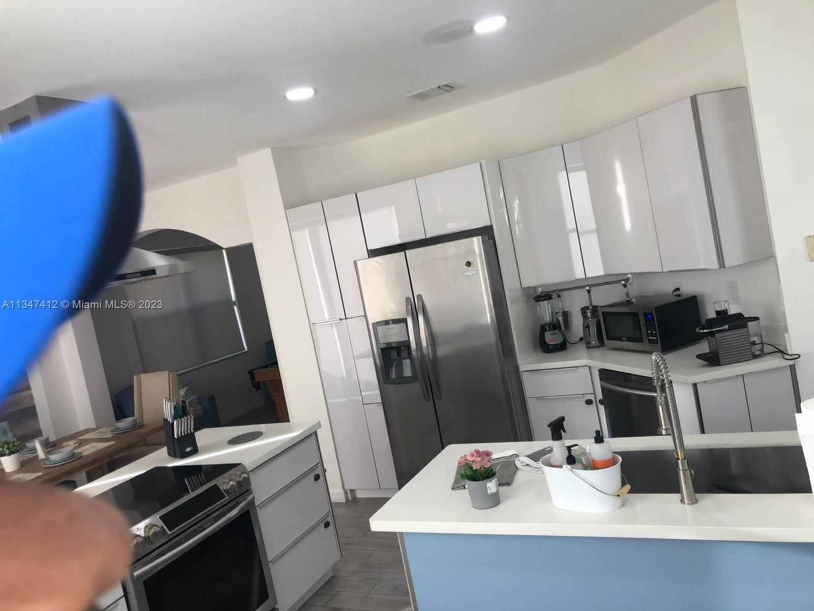 10836 Southwest 245th Street Homestead, FL 33032 - Photo 9 of 18 a kitchen with a sink appliances and cabinets