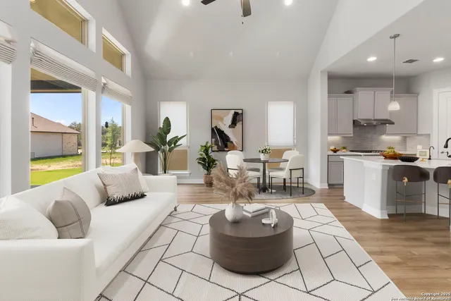 a living room with furniture and a rug