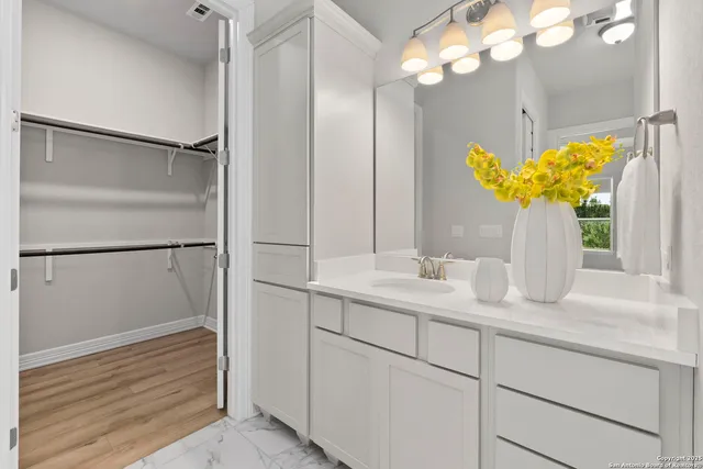 a bathroom with a sink and a mirror