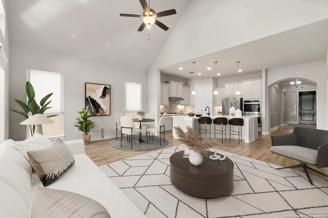 a living room with furniture and a chandelier
