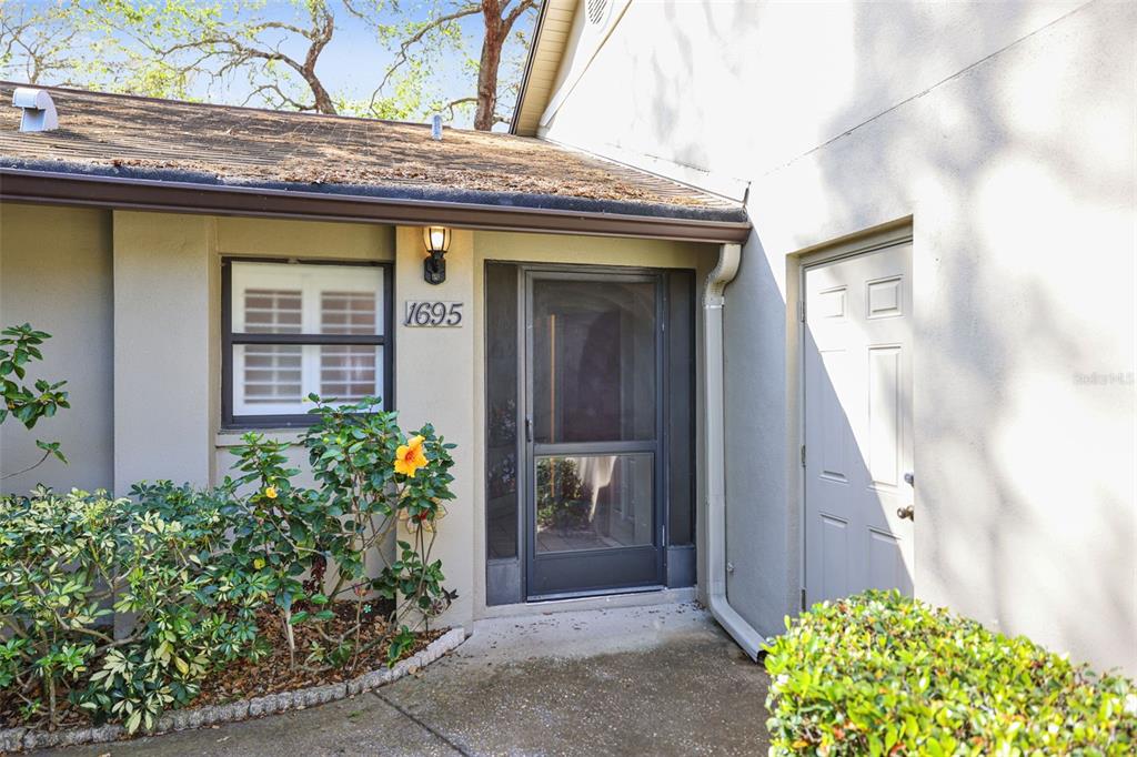 1695 Hamilton Court Dunedin, FL 34698 - Photo 1 of 1 Entry to 1695 Hamilton Ct