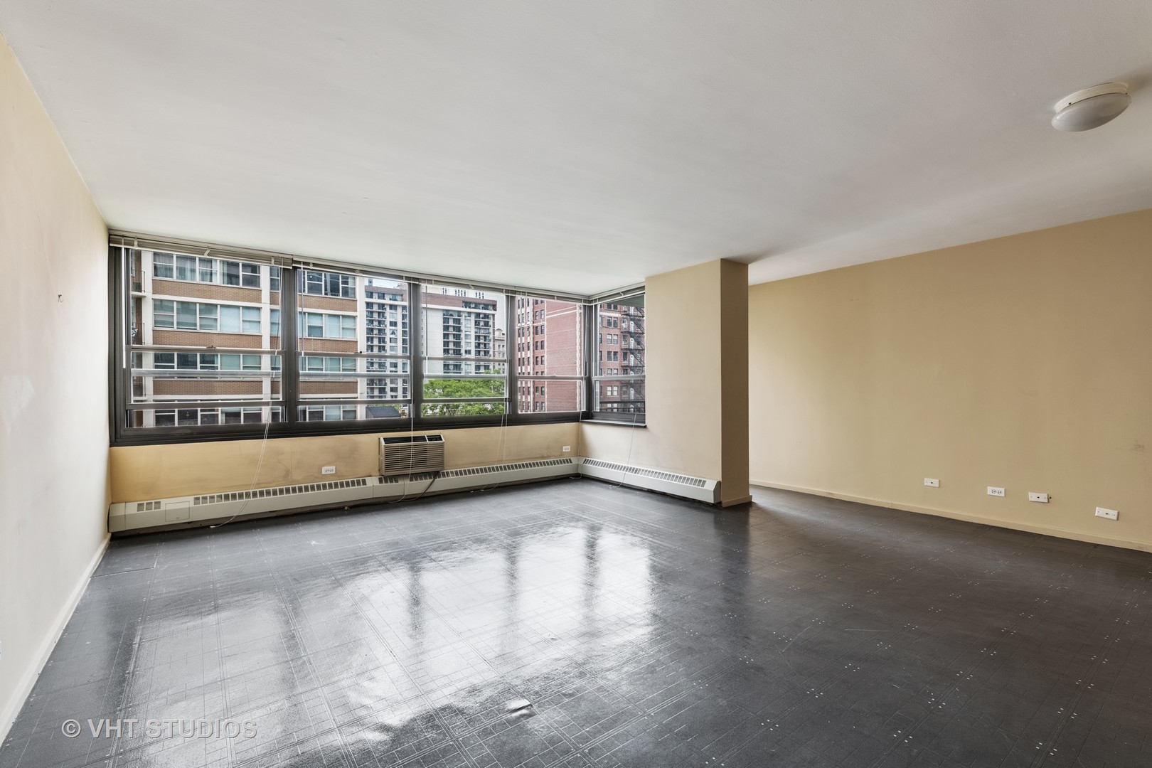33 East Cedar Street, Unit 8H Chicago, IL 60611 - Photo 5 of 15 a view of an empty room with a window