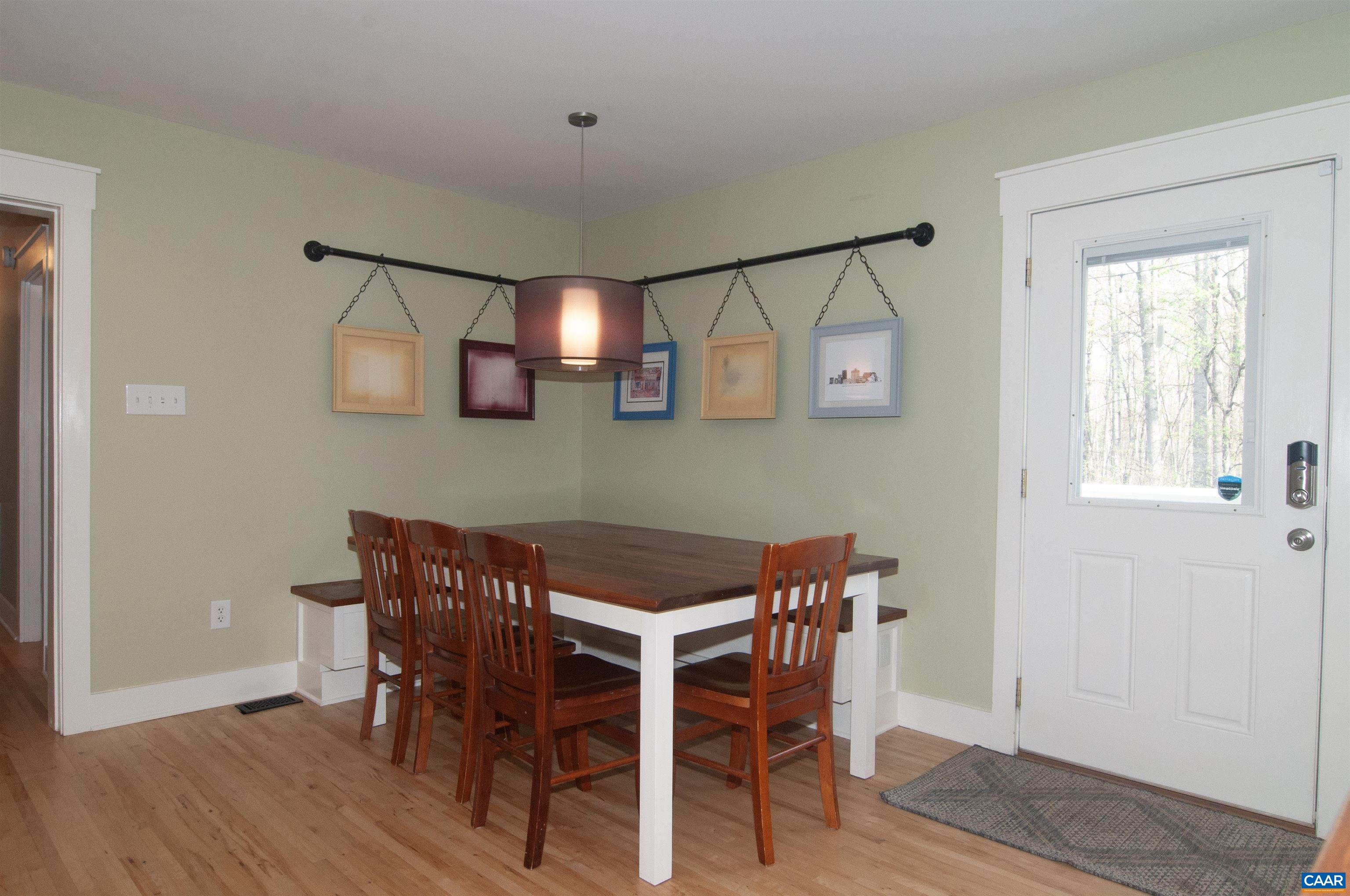 4600 Advance Mills Road Earlysville, VA 22936 - Photo 14 of 61 a view of a dining room with furniture and wooden floor
