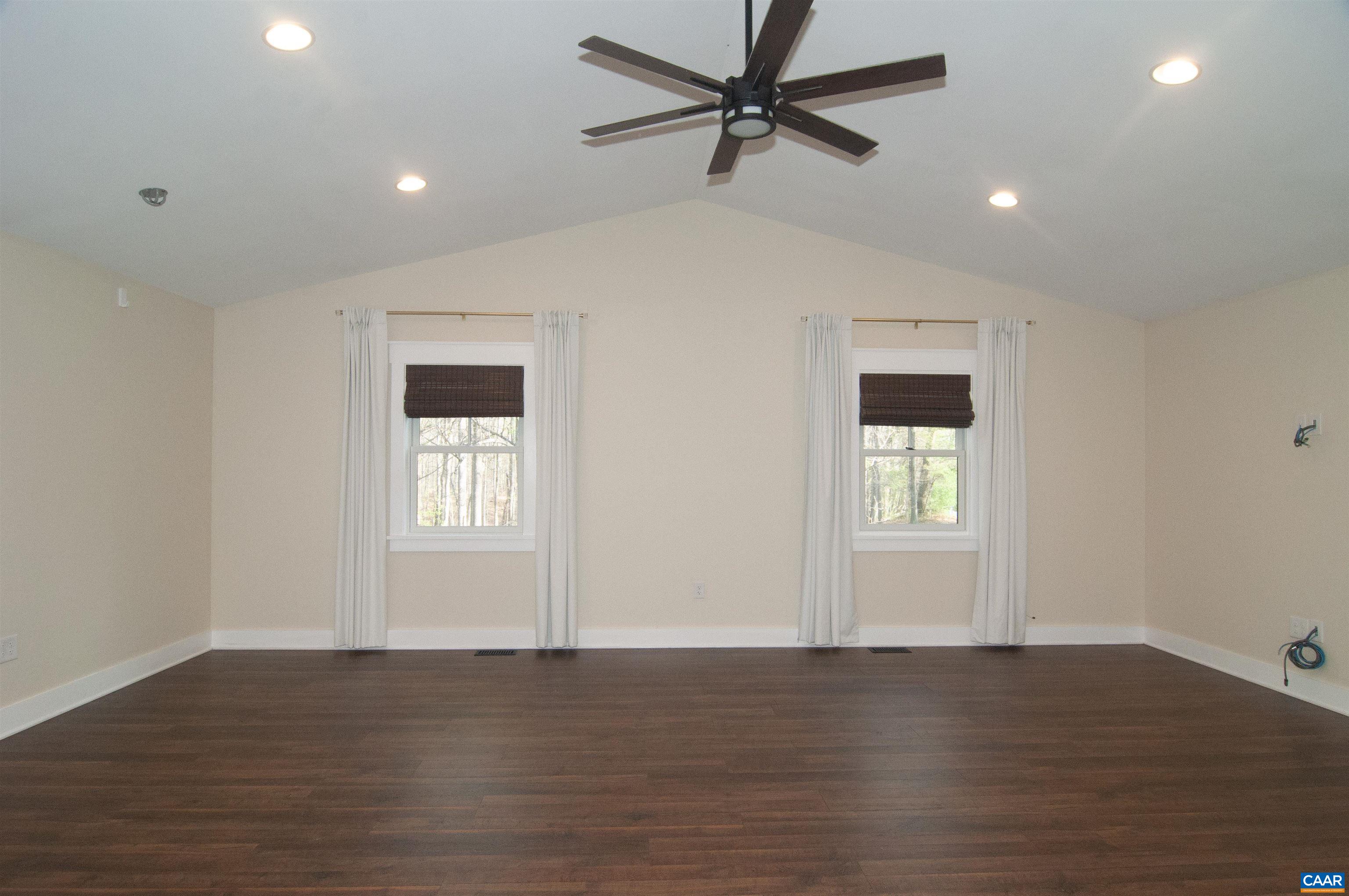 4600 Advance Mills Road Earlysville, VA 22936 - Photo 20 of 61 a view of an empty room with wooden floor and a window