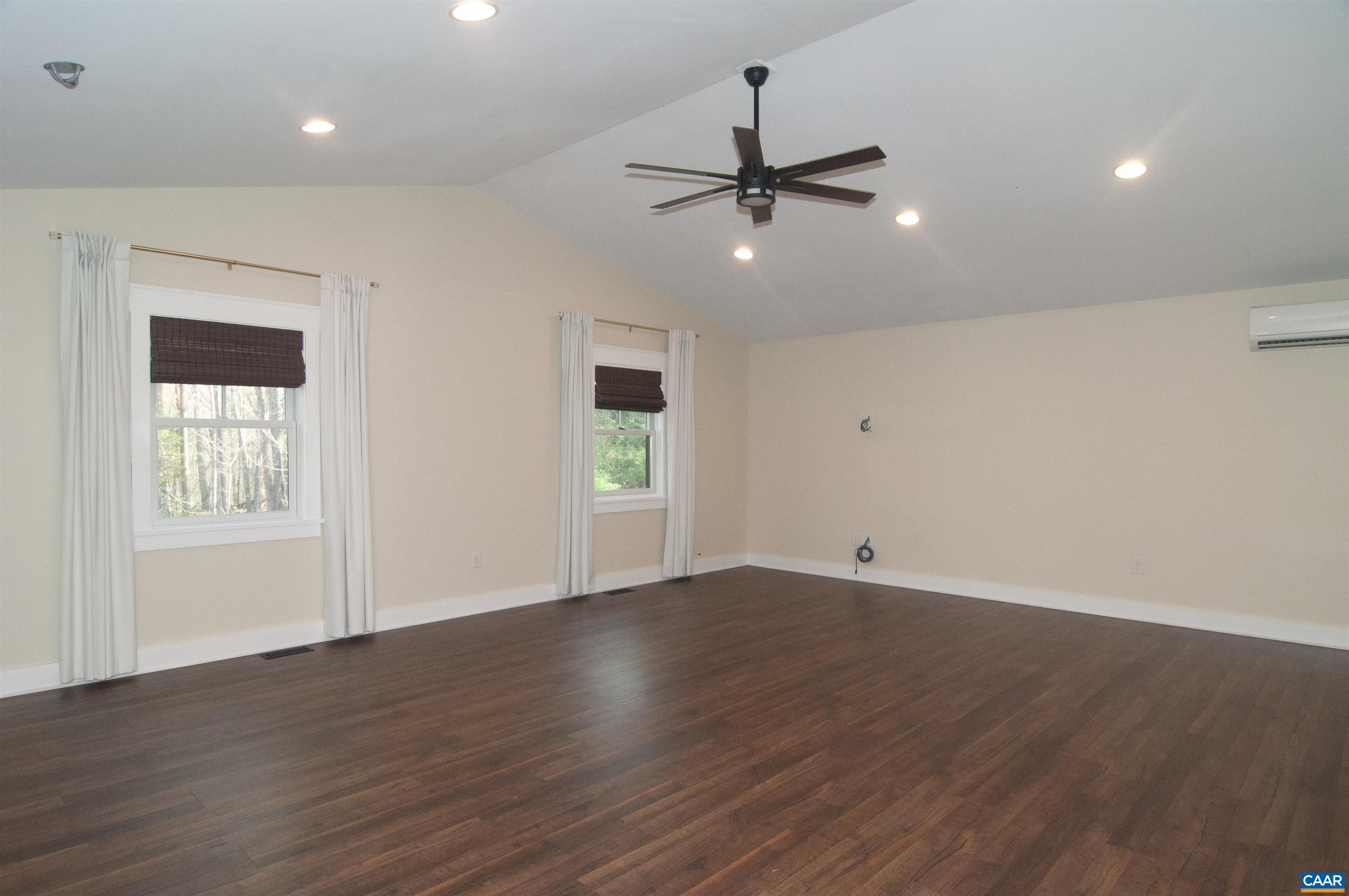 4600 Advance Mills Road Earlysville, VA 22936 - Photo 21 of 61 a view of an empty room with wooden floor and a window