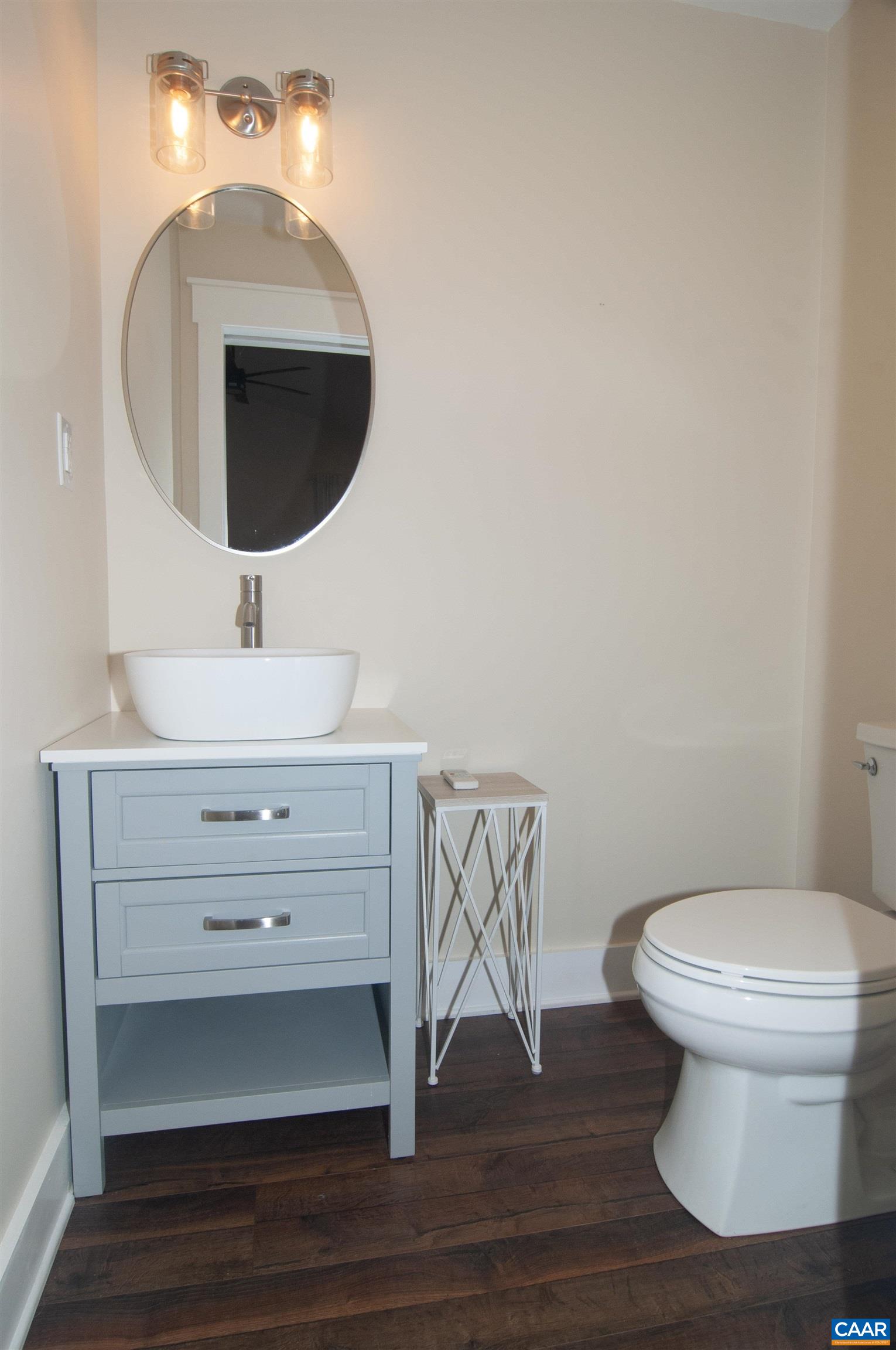 4600 Advance Mills Road Earlysville, VA 22936 - Photo 24 of 61 a bathroom with a toilet sink and mirror