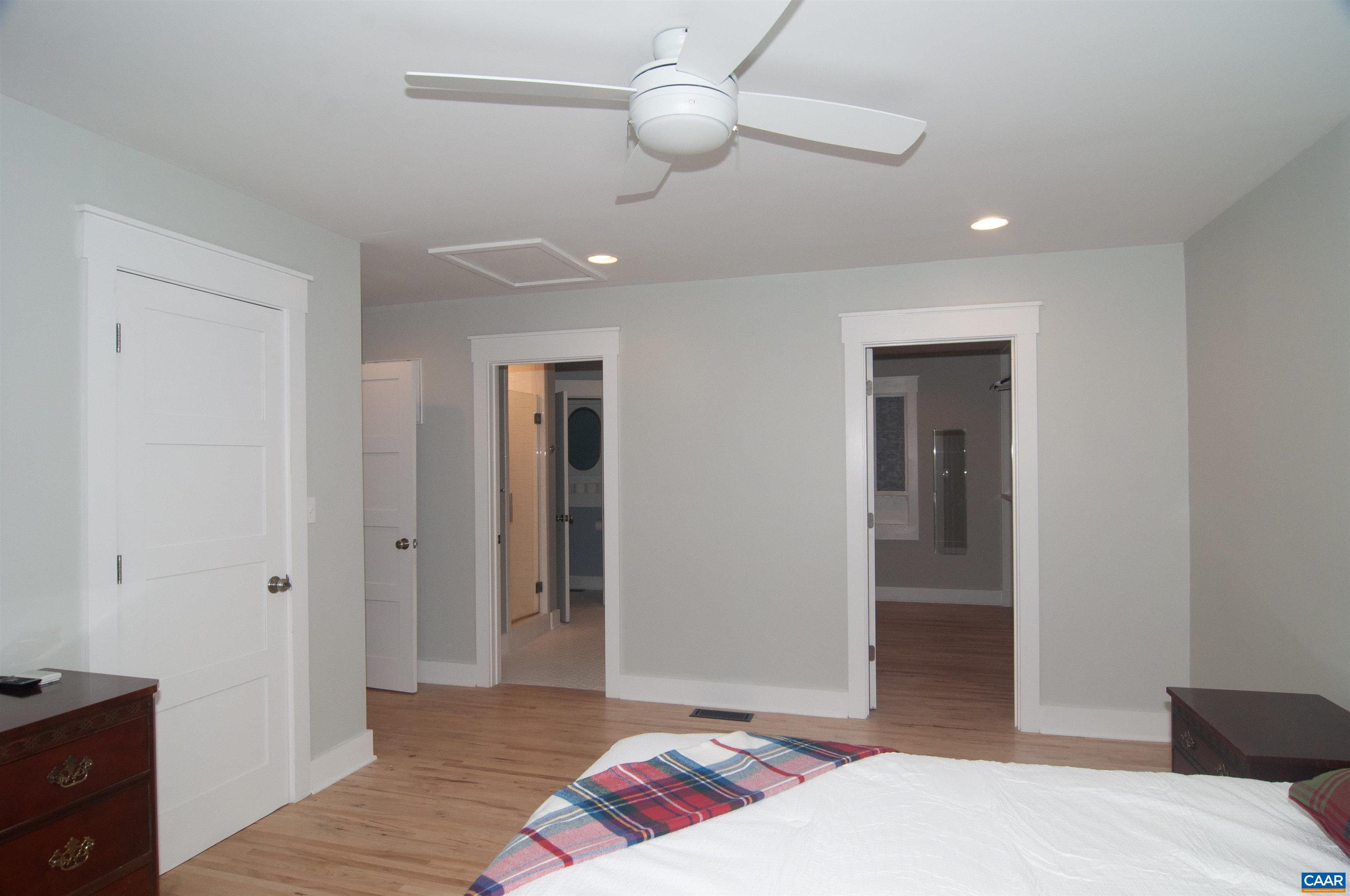 4600 Advance Mills Road Earlysville, VA 22936 - Photo 27 of 61 a bedroom with a bed and a lamp