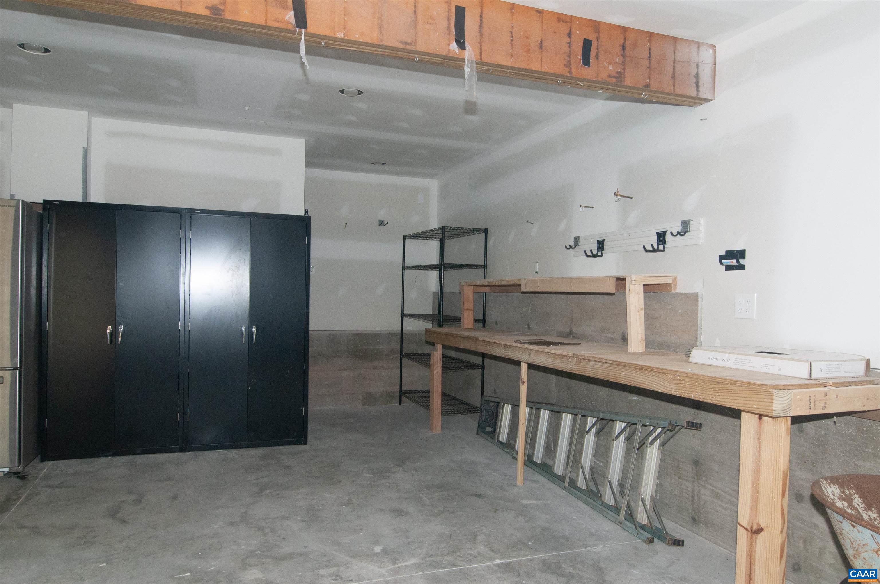 4600 Advance Mills Road Earlysville, VA 22936 - Photo 46 of 61 a kitchen with kitchen island a sink a stove and a refrigerator
