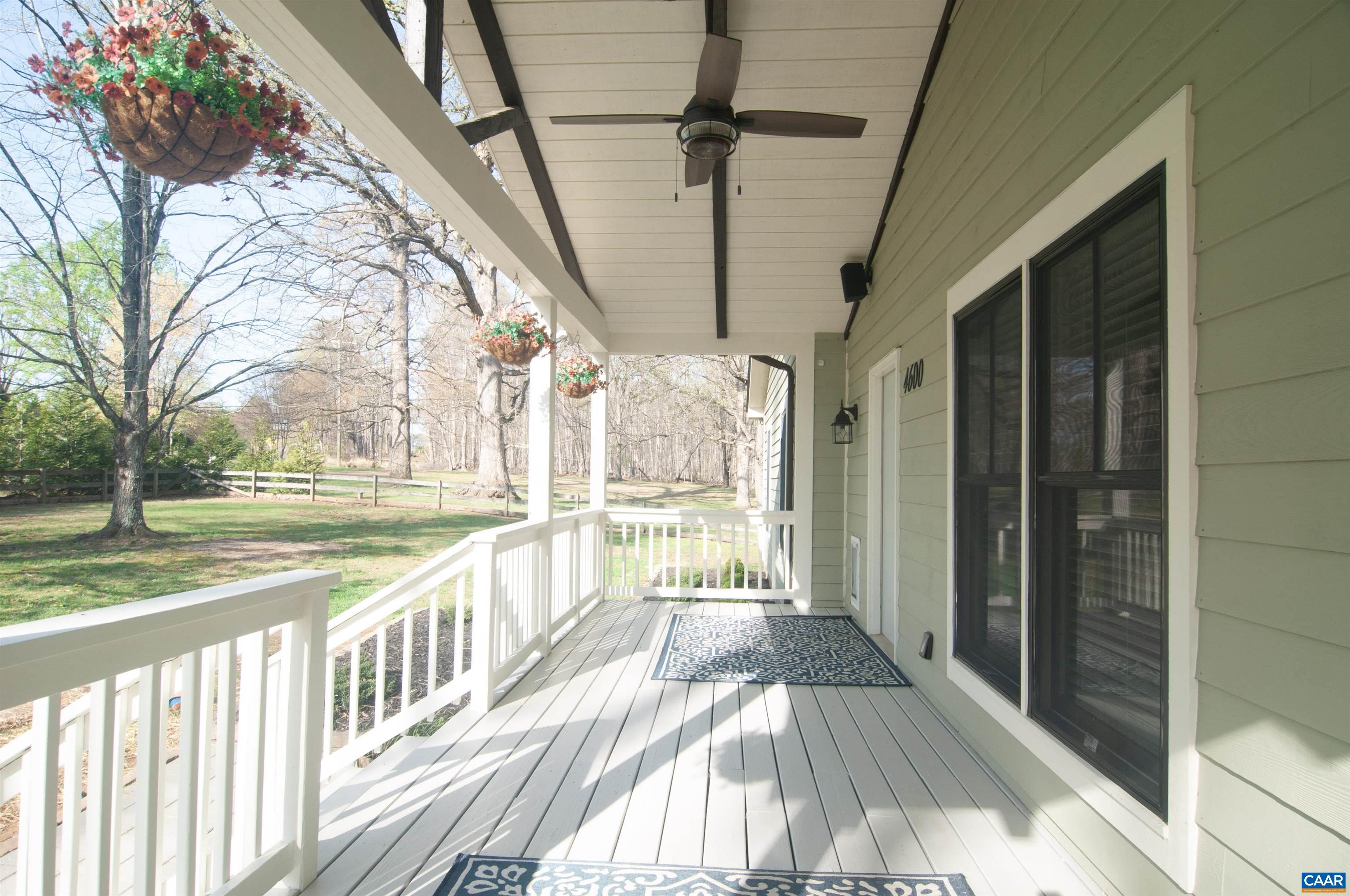 4600 Advance Mills Road Earlysville, VA 22936 - Photo 48 of 61 a view of a porch with wooden floor and iron stairs