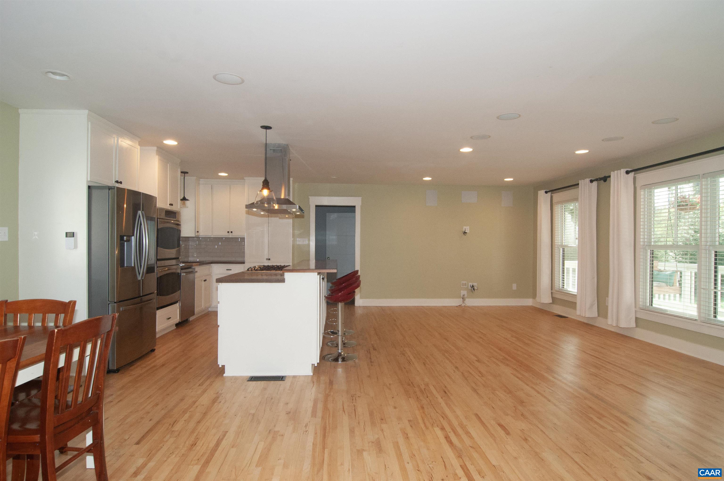 4600 Advance Mills Road Earlysville, VA 22936 - Photo 5 of 61 an open kitchen with a table and refrigerator