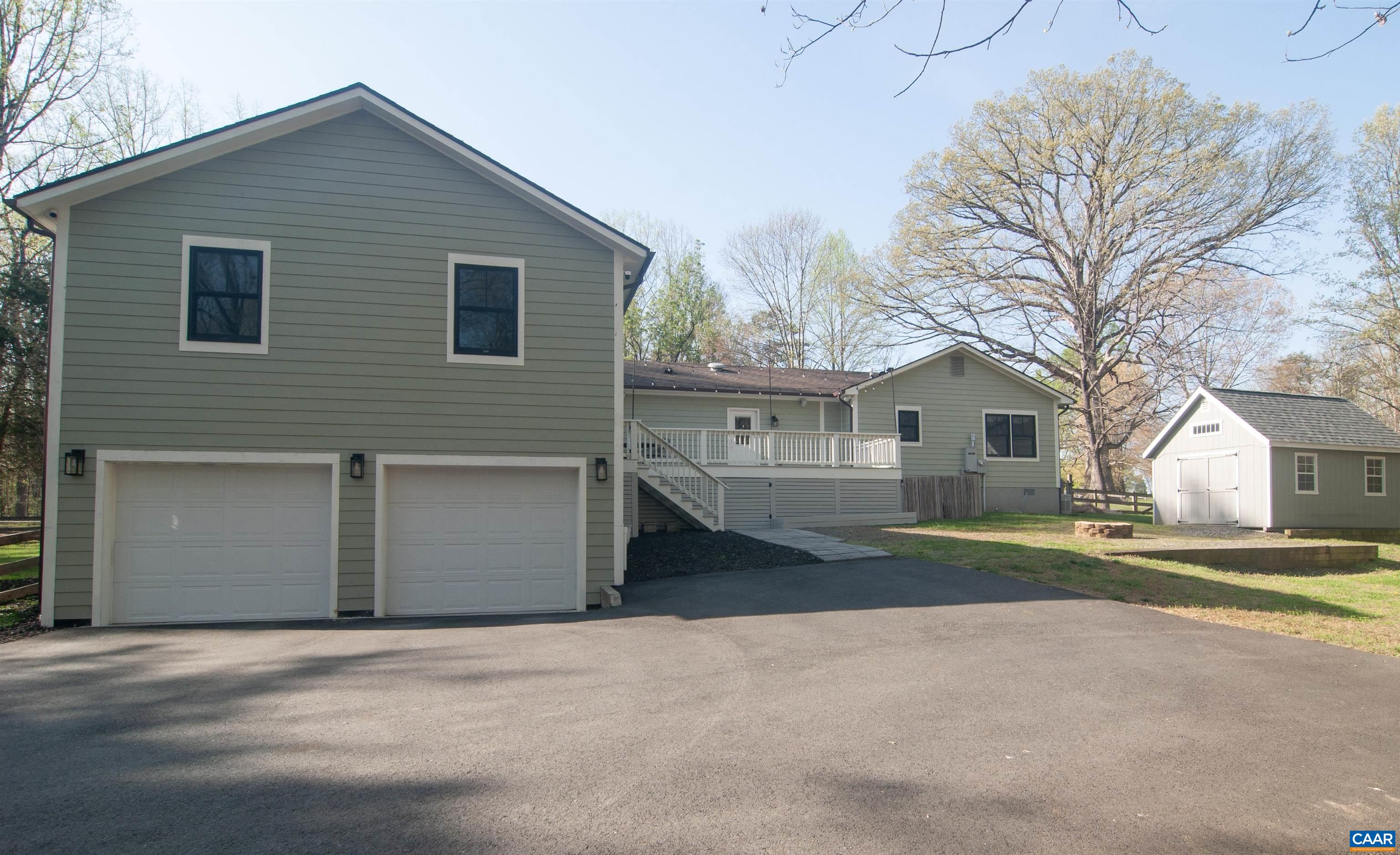 4600 Advance Mills Road Earlysville, VA 22936 - Photo 58 of 61 a front view of a house with a yard and garage