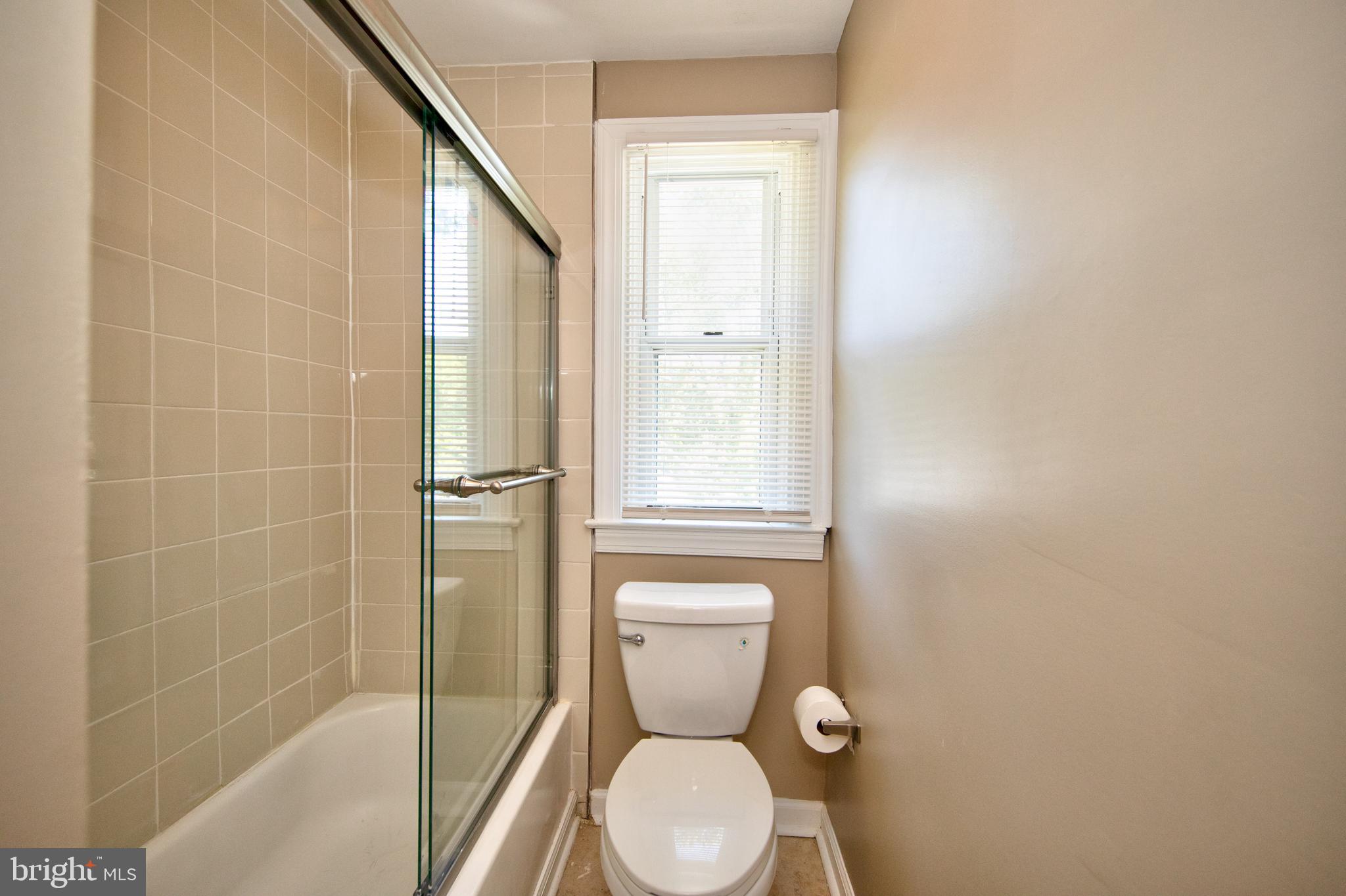 2326 Ivy Avenue Baltimore, MD 21214 - Photo 18 of 30 a bathroom with a toilet and a shower