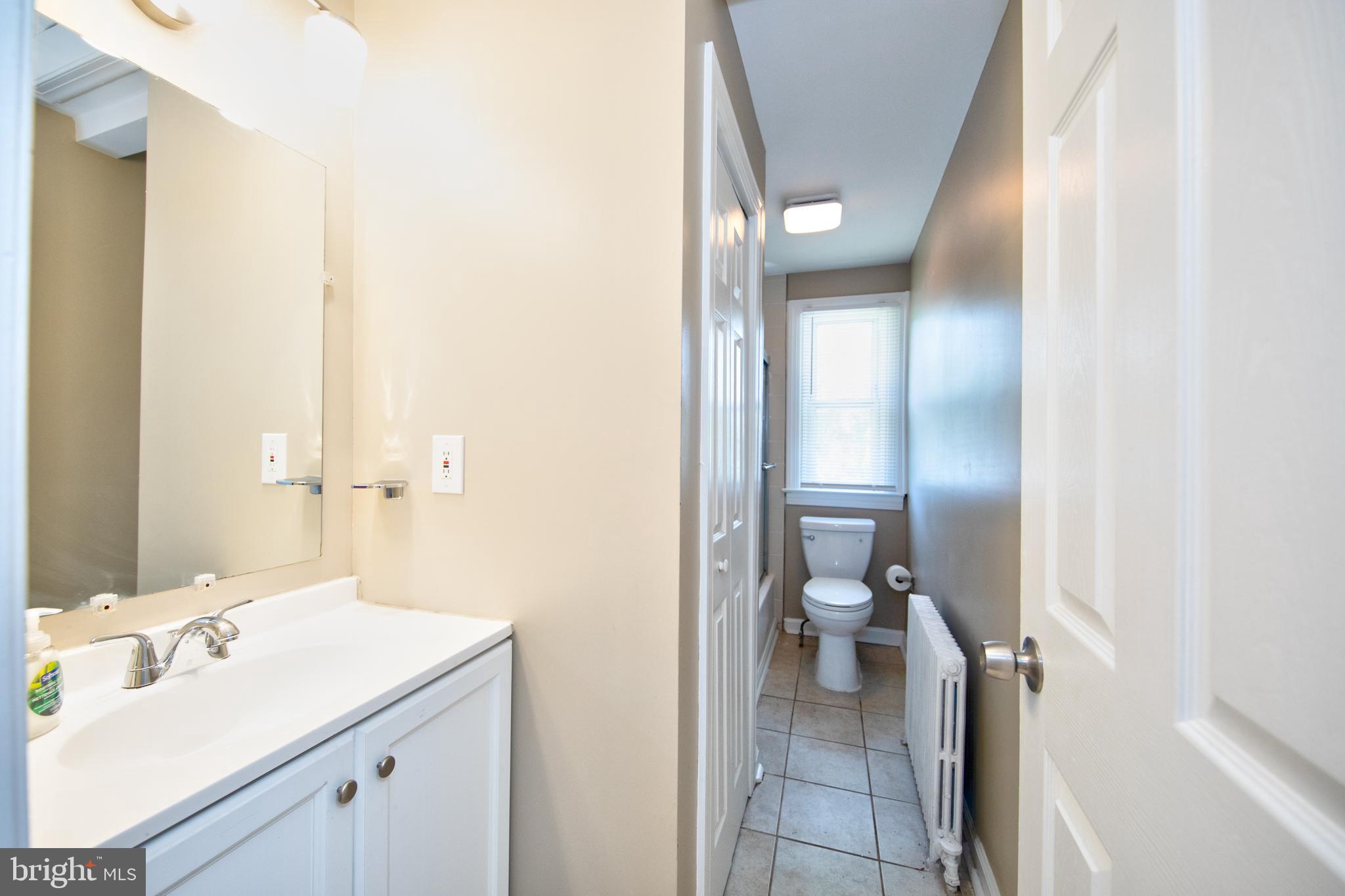 2326 Ivy Avenue Baltimore, MD 21214 - Photo 19 of 30 a bathroom with a sink and a toilet