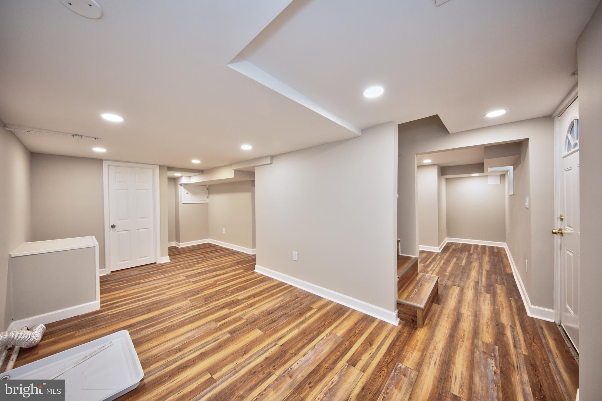 2326 Ivy Avenue Baltimore, MD 21214 - Photo 23 of 30 a view of a room with wooden floor and staircase