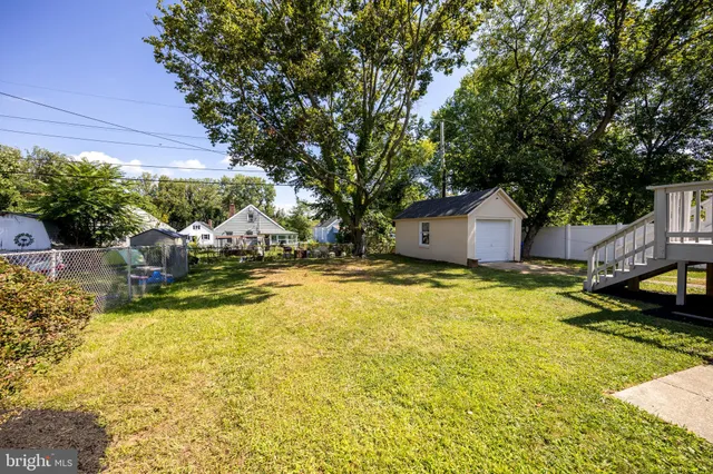 a swimming pool with outdoor seating and yard