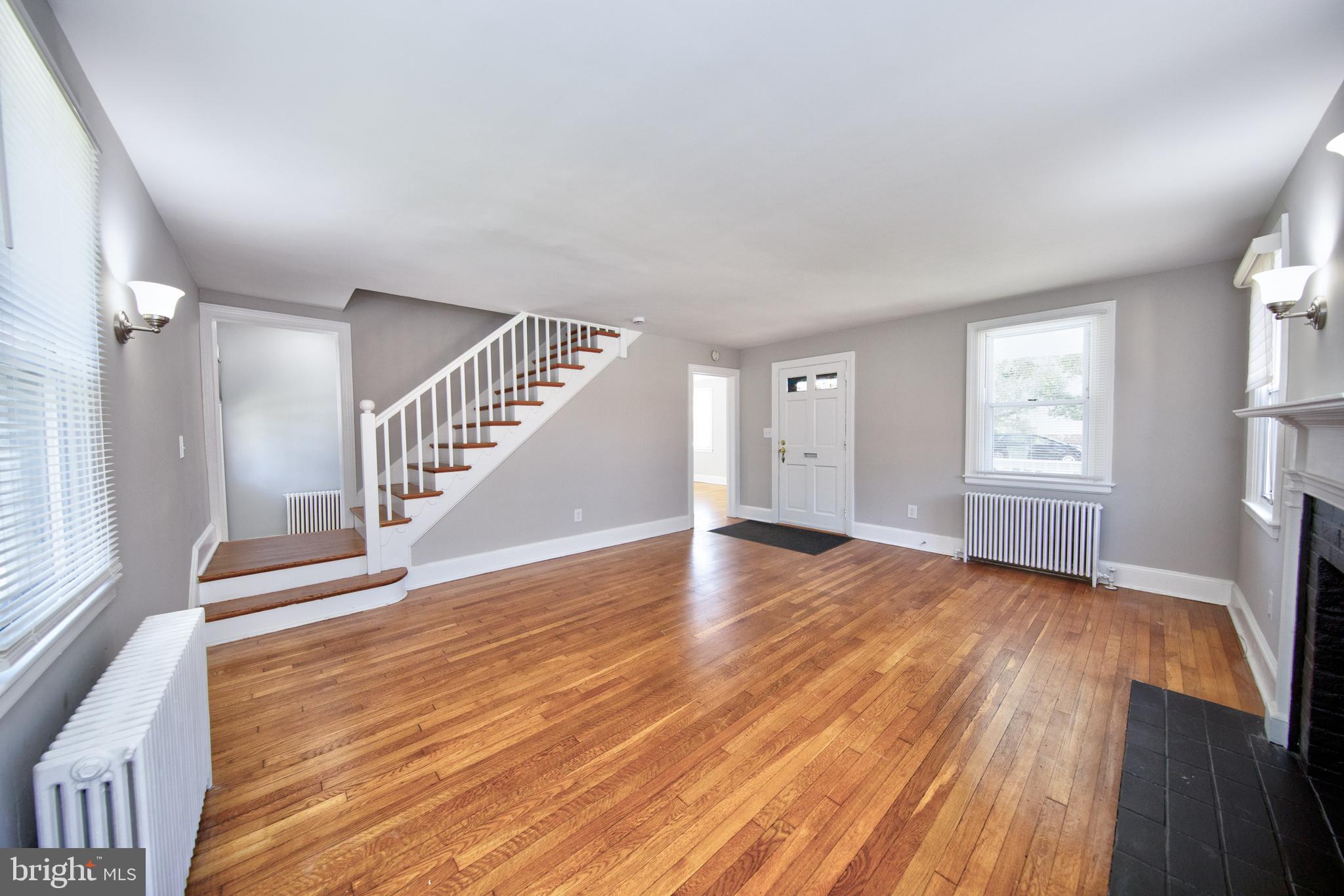 2326 Ivy Avenue Baltimore, MD 21214 - Photo 7 of 30 wooden floor in an empty room with a window