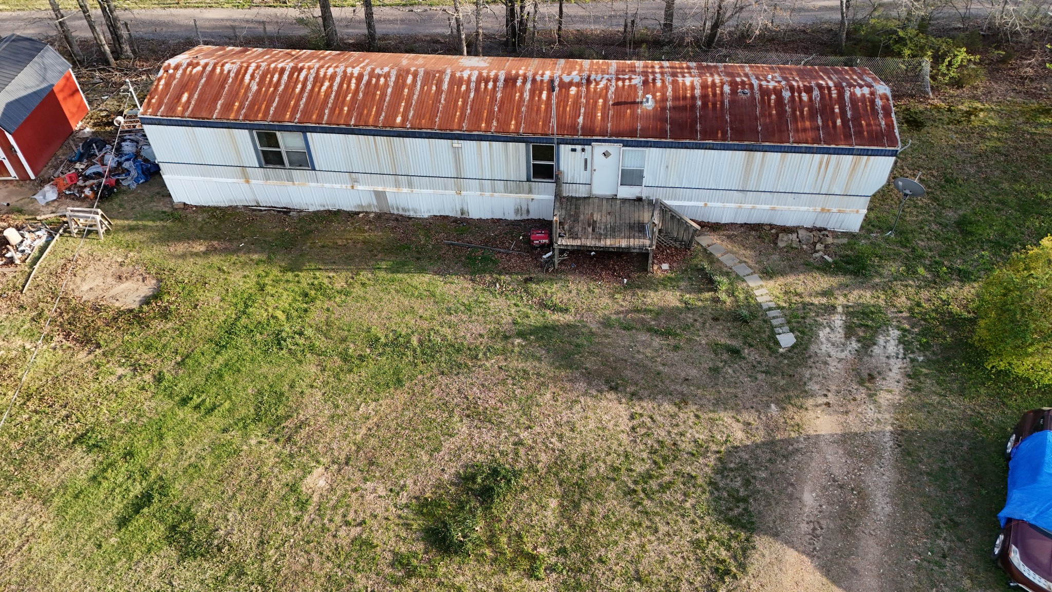 118 Oakwood Road Hohenwald, TN 38462 - Photo 18 of 21 a view of a house with a yard