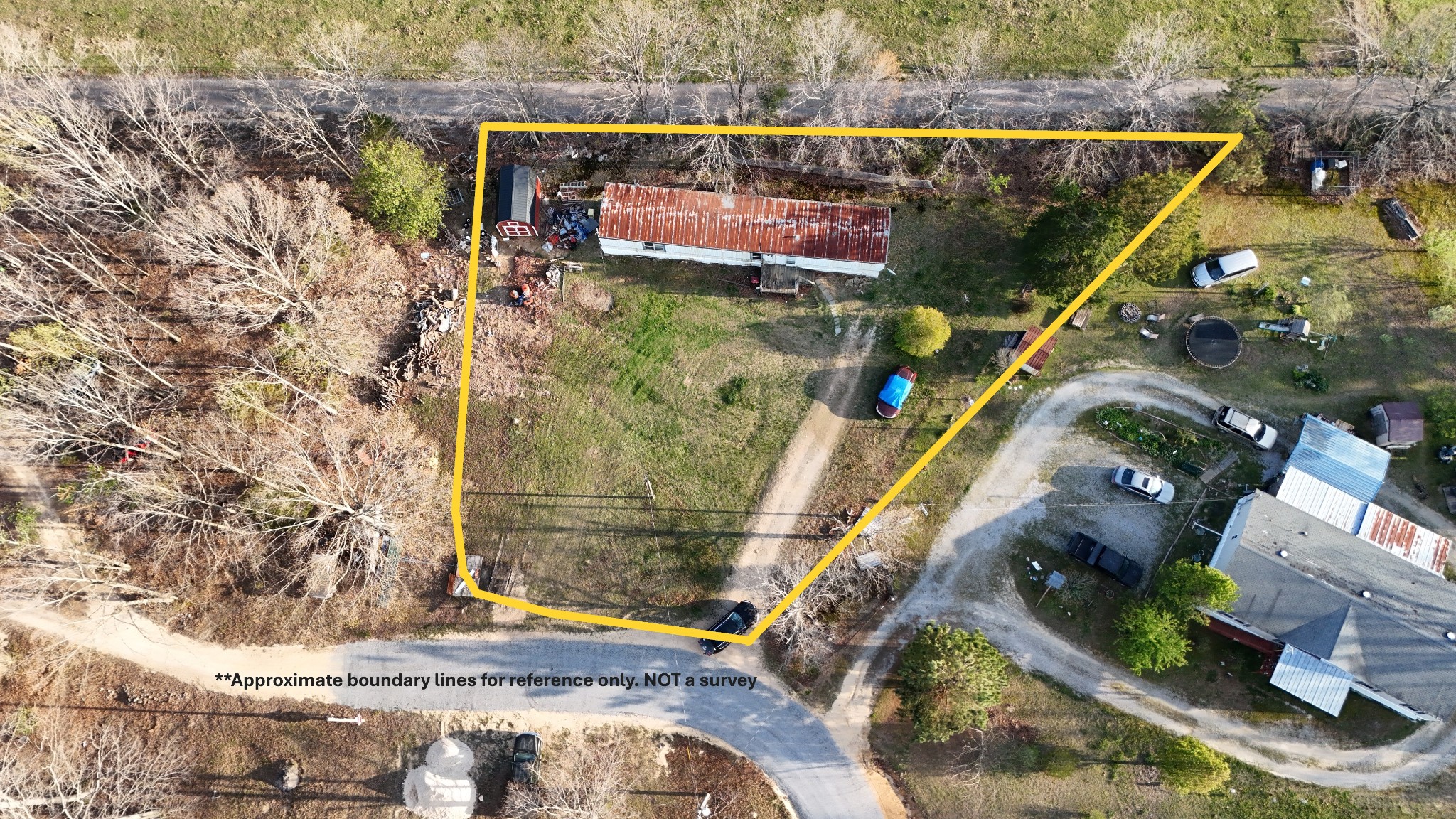 118 Oakwood Road Hohenwald, TN 38462 - Photo 2 of 21 an aerial view of residential houses with outdoor space