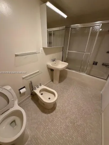a bathroom with a toilet and a sink
