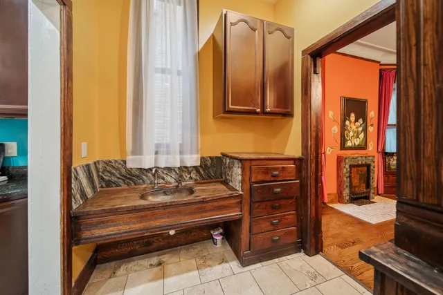 a bedroom with a bed and a fireplace