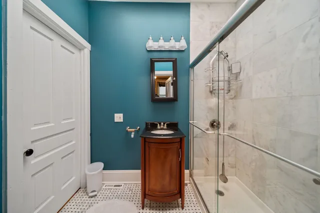 a bedroom with a bed and cabinets