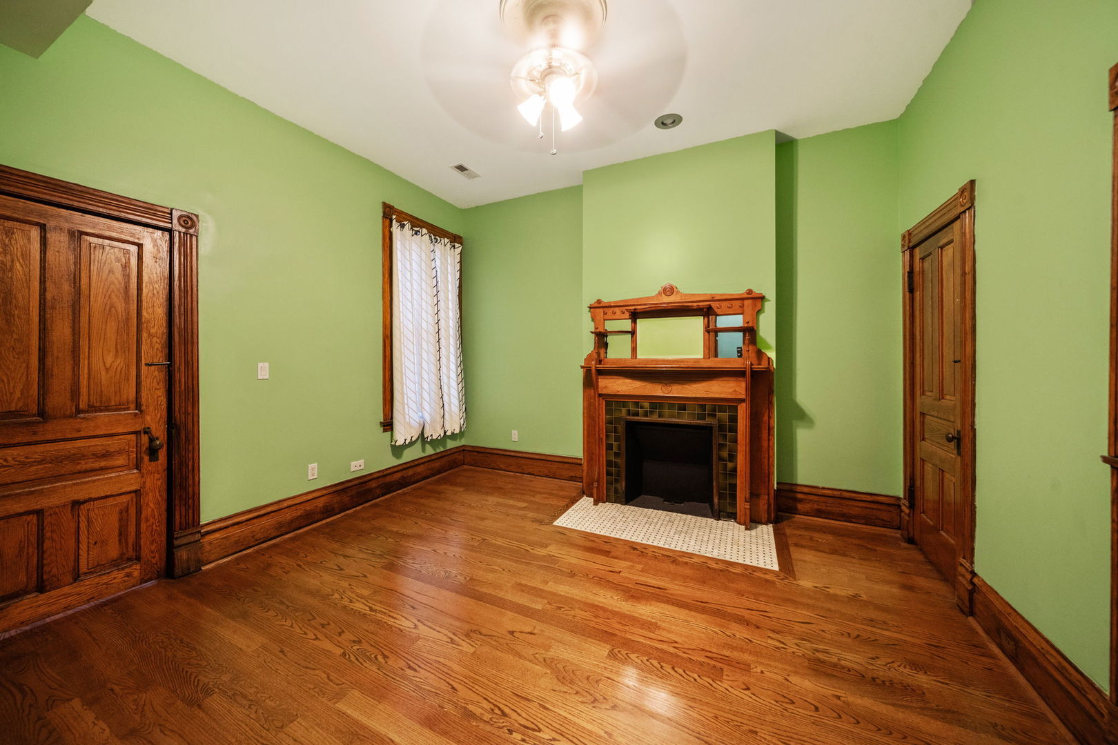 3602 South Prairie Avenue Chicago, IL 60653 - Photo 20 of 34 wooden floor fireplace and natural light