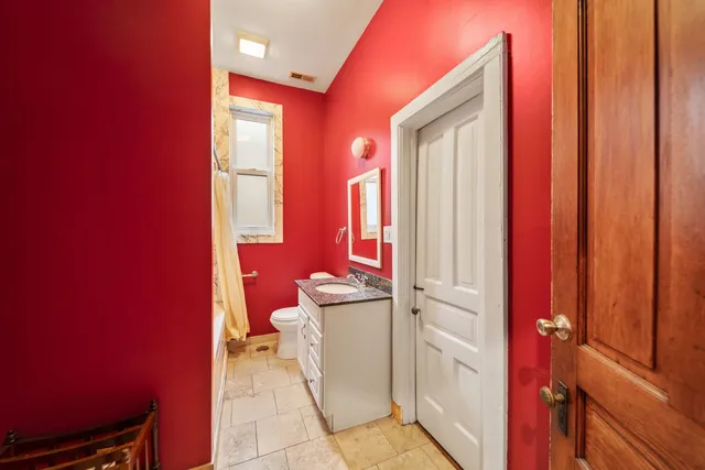 a view of a livingroom with furniture and a window