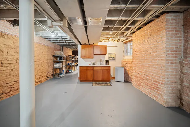 a view of an empty room with a fireplace