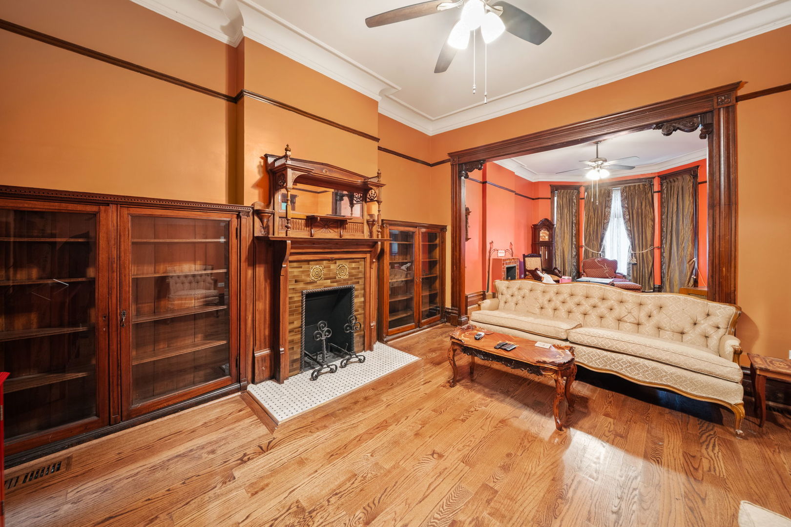 3602 South Prairie Avenue Chicago, IL 60653 - Photo 5 of 34 a living room with furniture a fireplace and chandelier
