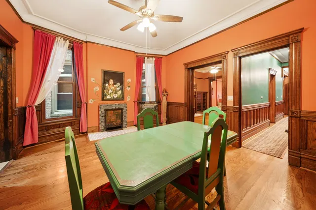 a dining room with furniture and wooden floor