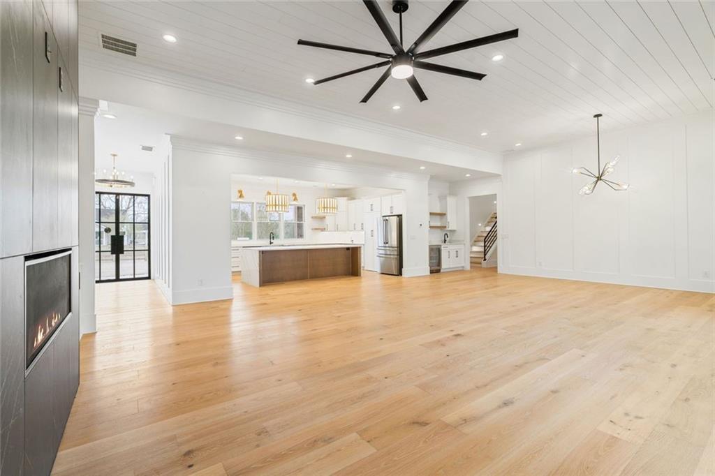 555 Lower Birmingham Road Canton, GA 30115 - Photo 45 of 104 a view of an empty room and kitchen view with wooden floor