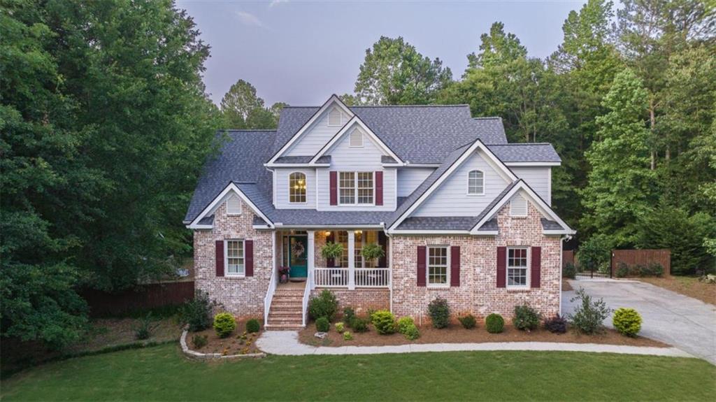 2125 Carl Moon Road Monroe, GA 30656 - Photo 1 of 1 a front view of a house with a yard and green space