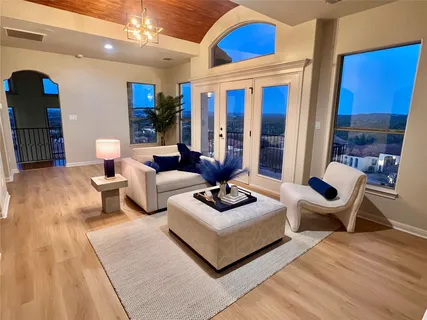 a living room with furniture and a large window