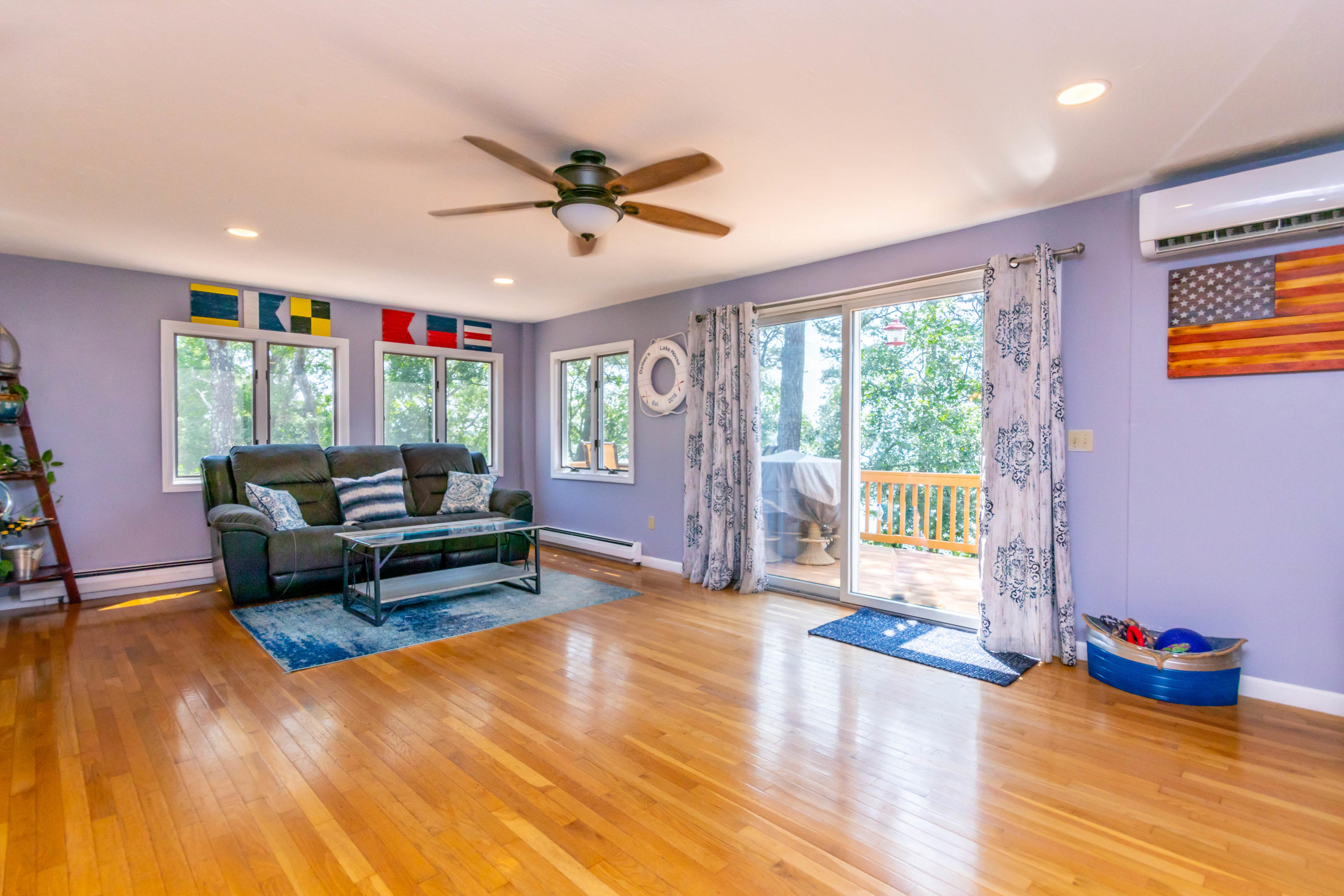 240 Wheeler Road Mashpee, MA 02649 - Photo 12 of 36 Living room with slider to deck with vie
