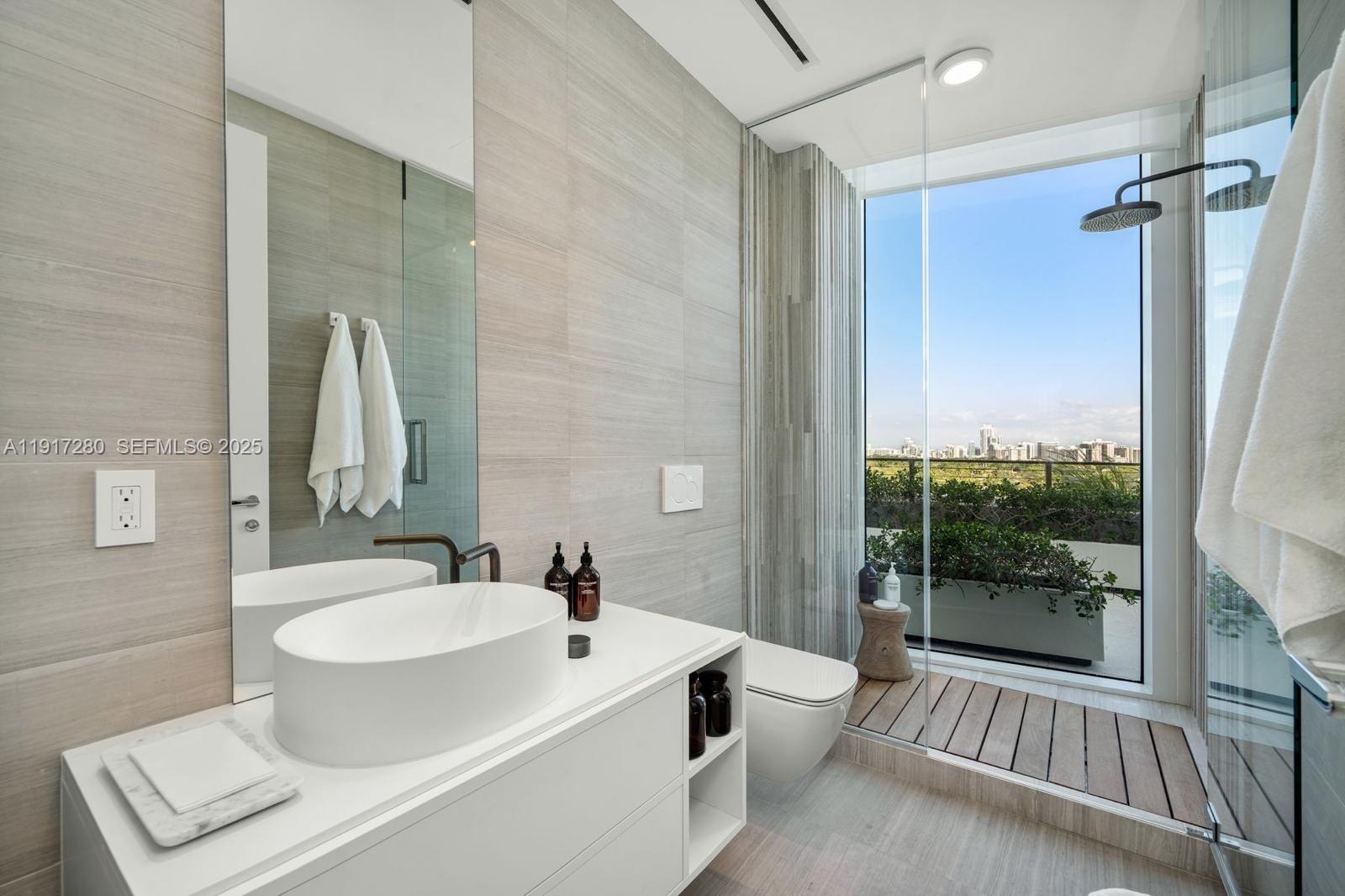 4701 Meridian Avenue, Unit UPH21 Miami Beach, FL 33140 - Photo 14 of 40 a bathroom with a sink toilet and shower