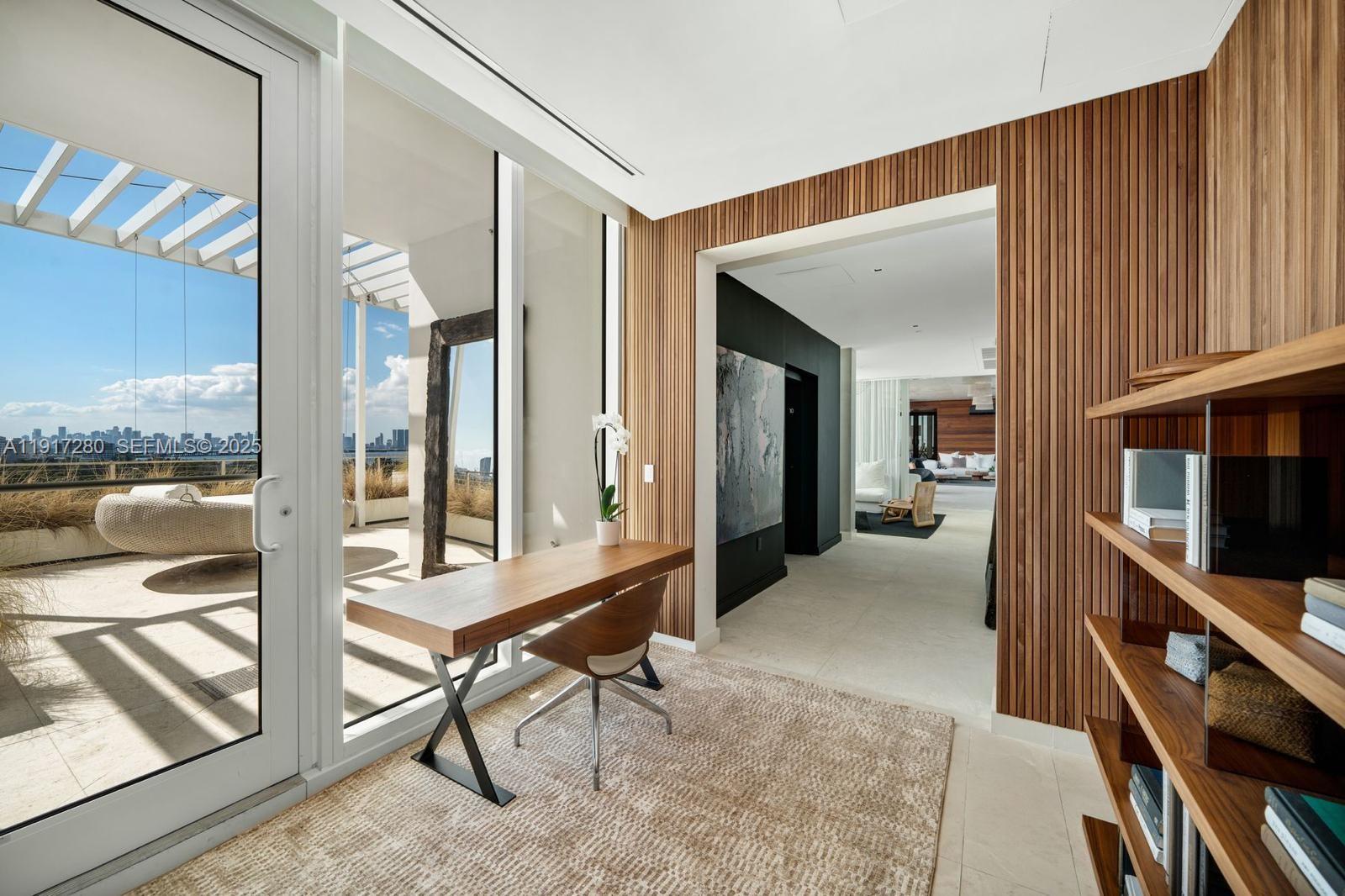 4701 Meridian Avenue, Unit UPH21 Miami Beach, FL 33140 - Photo 17 of 40 a view of a hallway with furniture and staircase