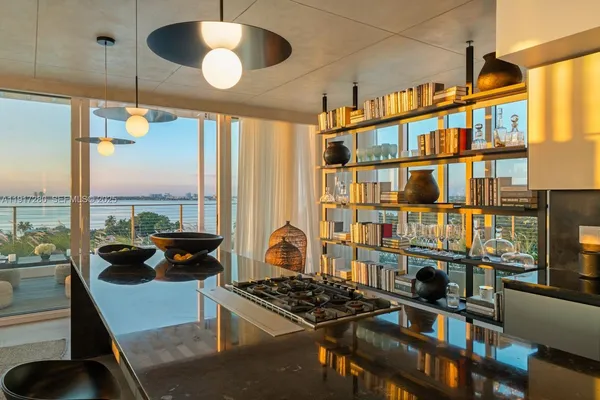a kitchen with a stove and a window