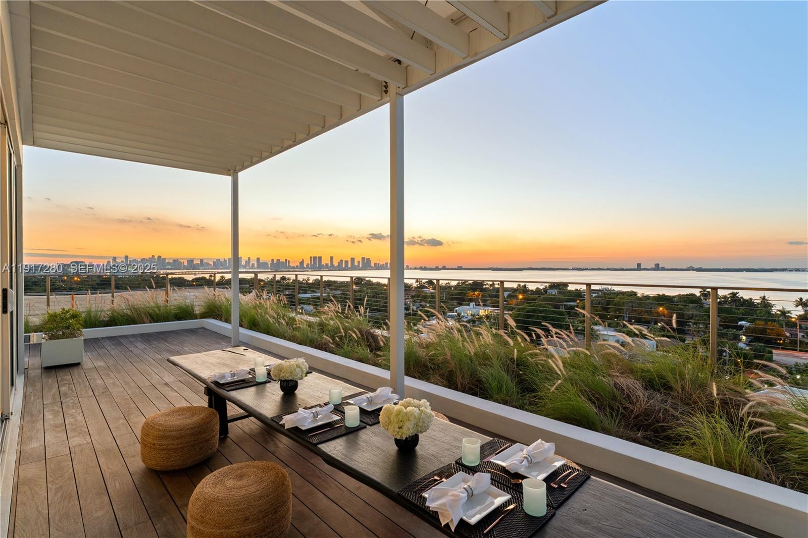 4701 Meridian Avenue, Unit UPH21 Miami Beach, FL 33140 - Photo 28 of 40 a view of roof deck with couches and wooden floor