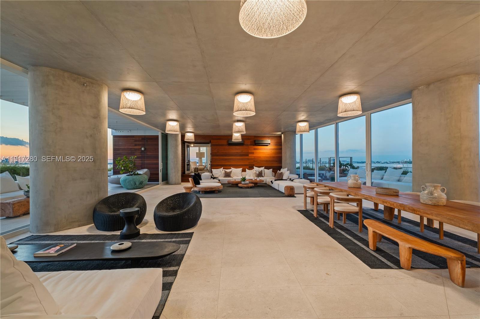 4701 Meridian Avenue, Unit UPH21 Miami Beach, FL 33140 - Photo 29 of 40 a lobby with furniture potted plant and a large mirror